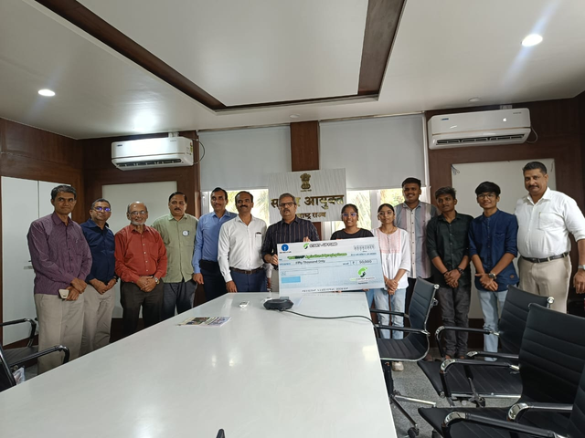 Seed fund cheque presentation with student innovators at government office